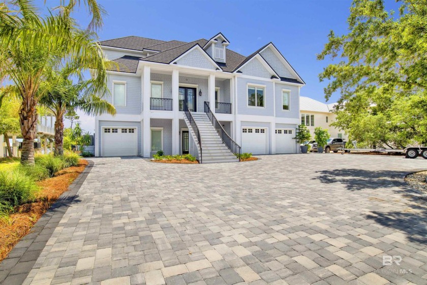 Just minutes from the Pass and white sandy beaches, this - Beach Home for sale in Orange Beach, Alabama on Beachhouse.com