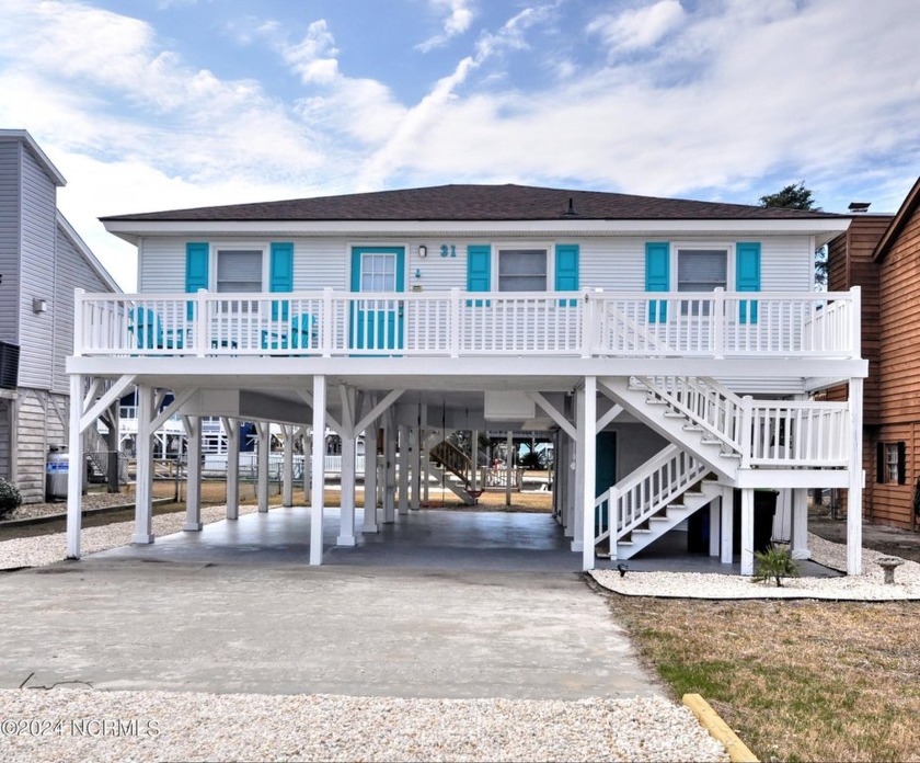 Treat yourself to this gorgeous canal home that would serve well - Beach Home for sale in Ocean Isle Beach, North Carolina on Beachhouse.com