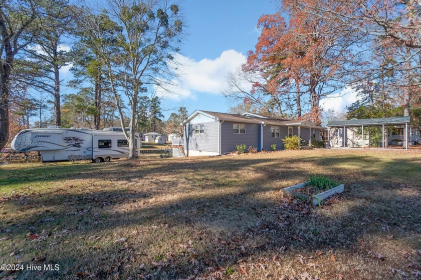 Nestled in the tranquility of the Snug Harbor community, this - Beach Home for sale in Hertford, North Carolina on Beachhouse.com