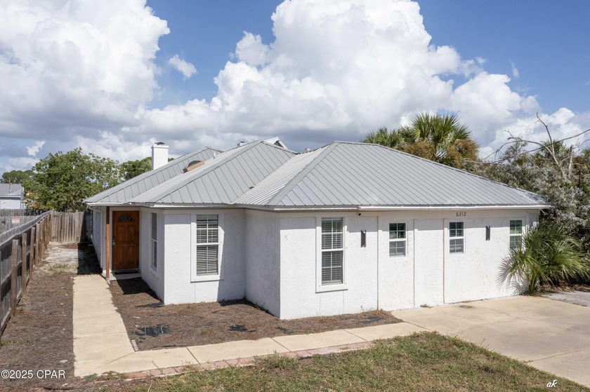 Just steps from the beach, this beautifully updated coastal home - Beach Home for sale in Panama City, Florida on Beachhouse.com