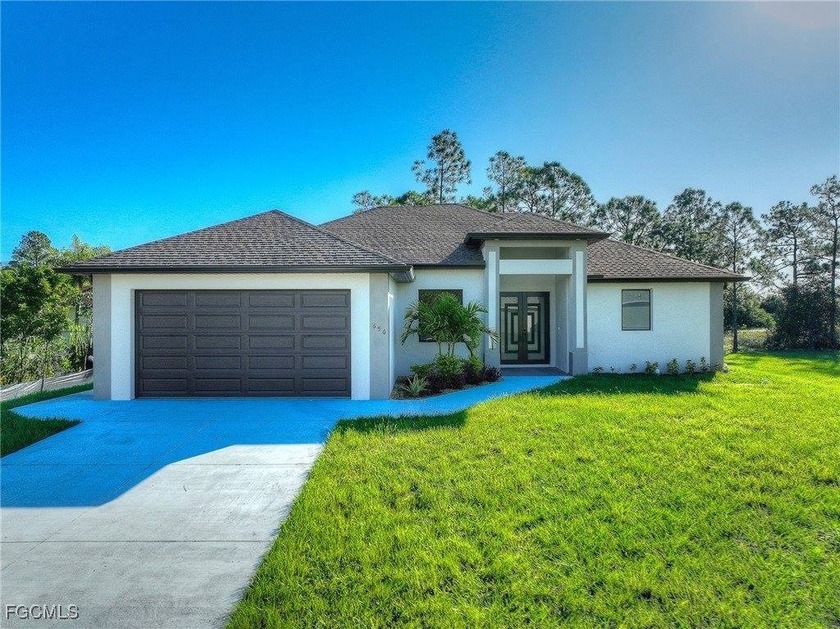 Welcome to this stunning new construction home situated on an - Beach Home for sale in Lehigh Acres, Florida on Beachhouse.com