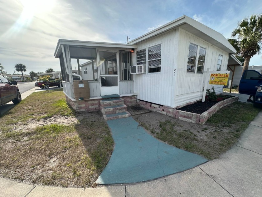 Step into this beautifully updated 3-bedroom, 1.5-bath gem - Beach Home for sale in Largo, Florida on Beachhouse.com