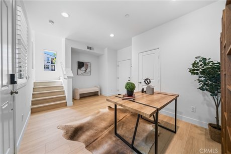 Step into the world of modern luxury with this stunning end-unit - Beach Townhome/Townhouse for sale in Signal Hill, California on Beachhouse.com