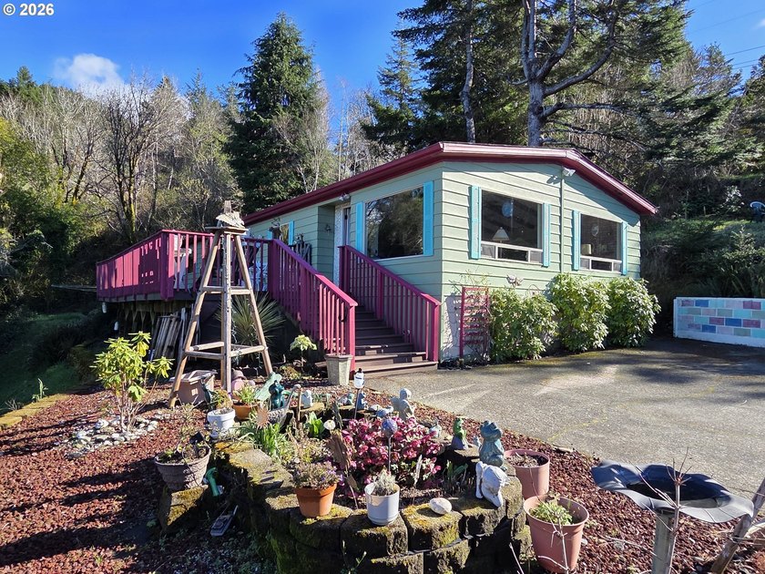 The cutest single level home with a river and mountain view plus - Beach Home for sale in Gold Beach, Oregon on Beachhouse.com