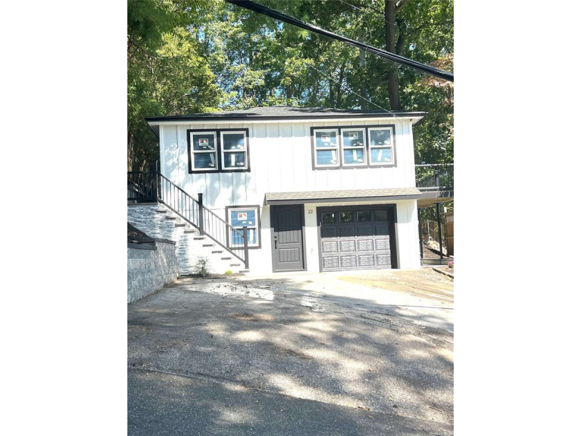 A high Ranch house with 4 bedrooms and 3 bathrooms overlooking a - Beach Home for sale in Centerport, New York on Beachhouse.com