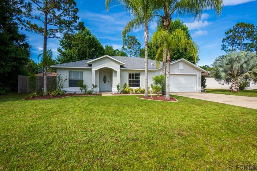 This Move in Ready 3 Bed 2 Bath home with a bright and airy - Beach Home for sale in Palm Coast, Florida on Beachhouse.com