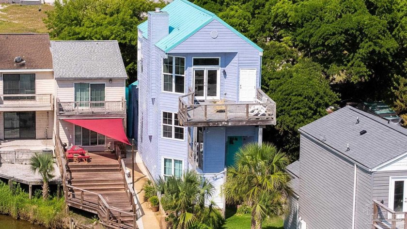 Tucked away on the waterfront along Bayou Chico, this 3-story - Beach Home for sale in Pensacola, Florida on Beachhouse.com