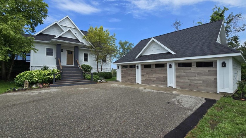 Unrivaled Lakefront Luxury - Panoramic Views of Portage Lake - Beach Home for sale in Onekama, Michigan on Beachhouse.com