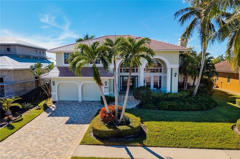 Welcome to this stunning two-story waterfront home offering 4 - Beach Home for sale in Marco Island, Florida on Beachhouse.com
