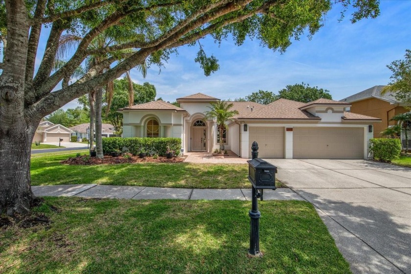 Situated on an oversized corner lot in the sought-after gated - Beach Home for sale in Tampa, Florida on Beachhouse.com