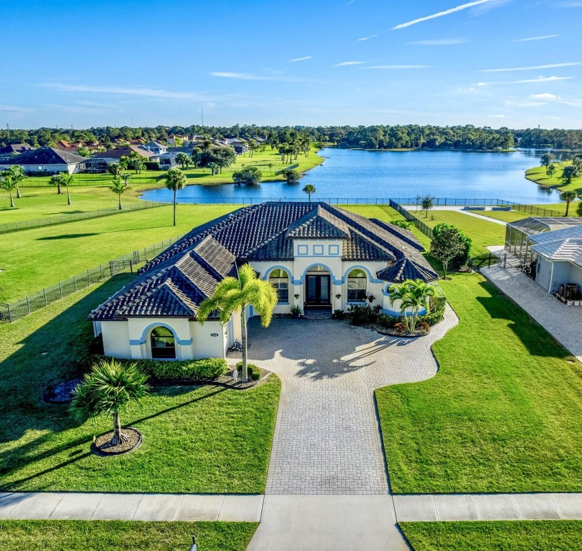EXQUISITE NATURAL LAKEFRONT CUSTOM HOME ON NEARLY AN ACRE WITH - Beach Home for sale in Melbourne, Florida on Beachhouse.com
