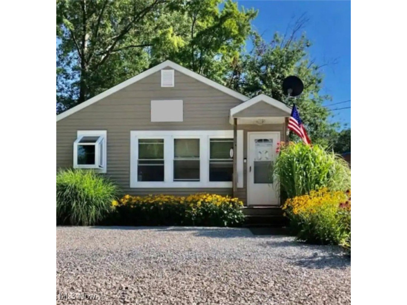 This cozy cottage is ideally located just off the famous - Beach Home for sale in Geneva, Ohio on Beachhouse.com