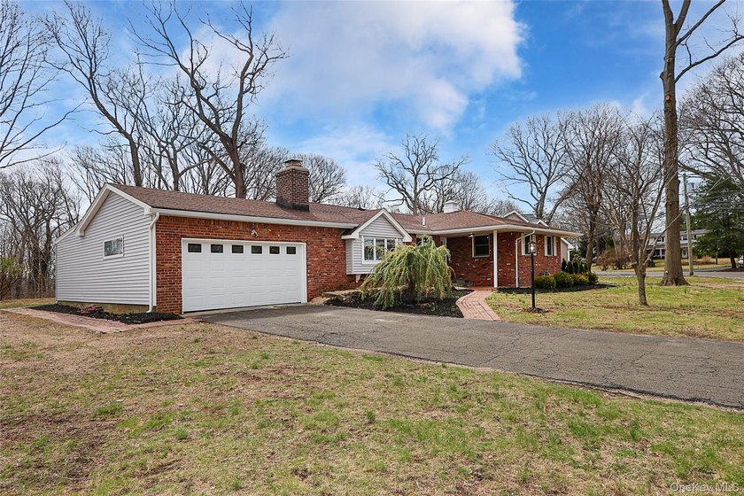 Welcome to this beautifully renovated ranch nestled in the heart - Beach Home for sale in Huntington, New York on Beachhouse.com