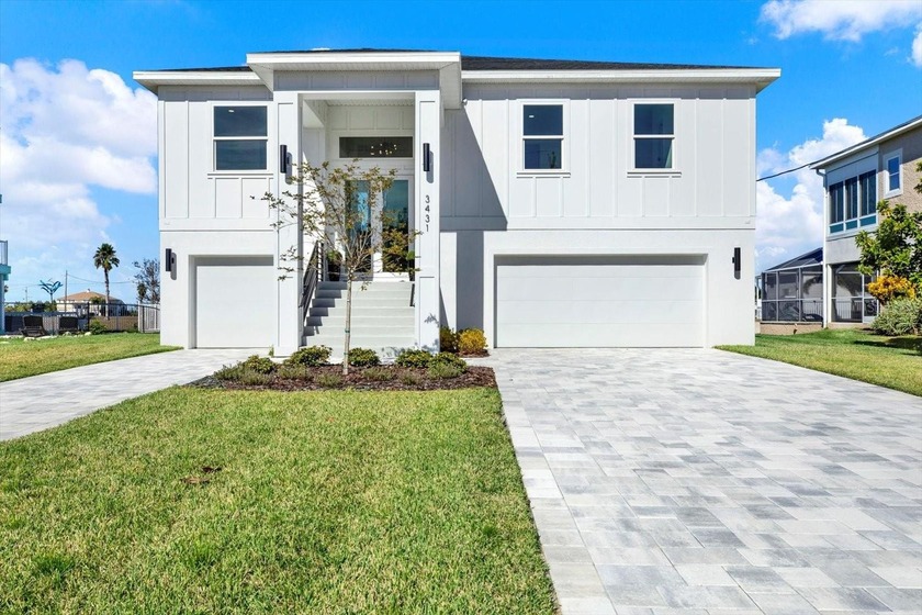 Experience the epitome of coastal luxury in this brand-new - Beach Home for sale in Hernando Beach, Florida on Beachhouse.com