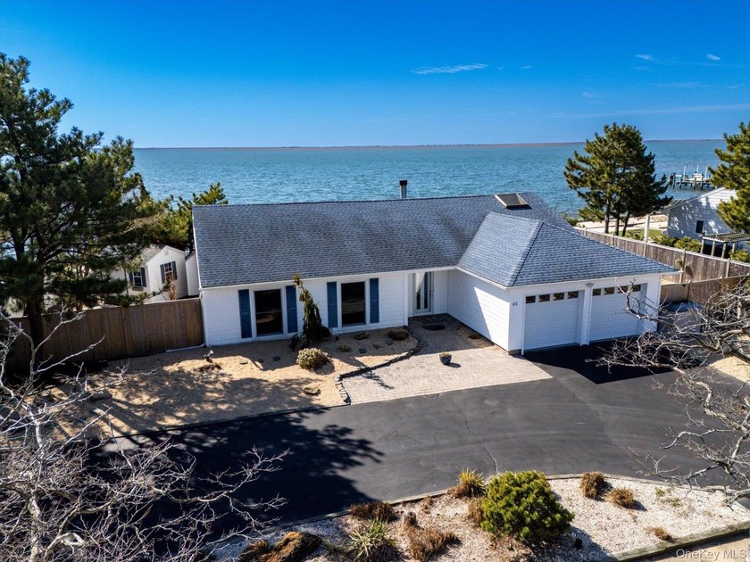 The dream of open bayfront living awaits you in the exclusive - Beach Home for sale in Copiague, New York on Beachhouse.com