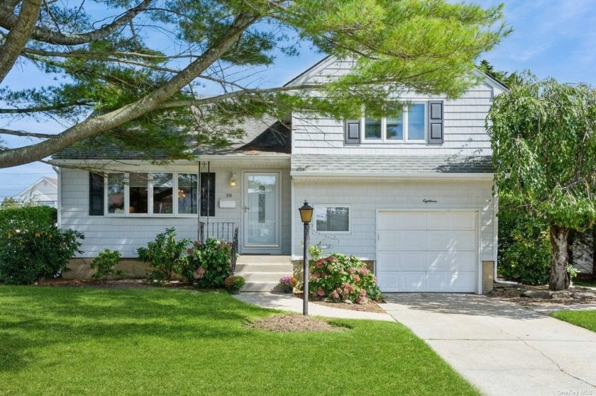 This split-level home, located on a tree lined street, is - Beach Home for sale in Massapequa, New York on Beachhouse.com