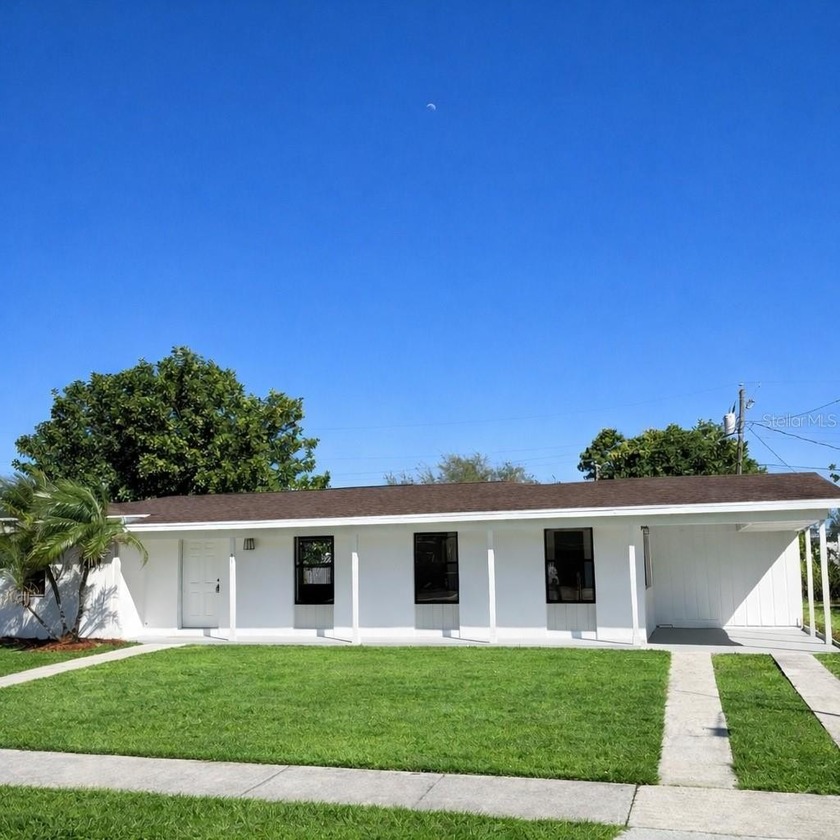 GORGEOUS CONCRETE SINGLE FAMILY HOME ON A SUPER CENTRAL LOCATED - Beach Home for sale in Port Charlotte, Florida on Beachhouse.com