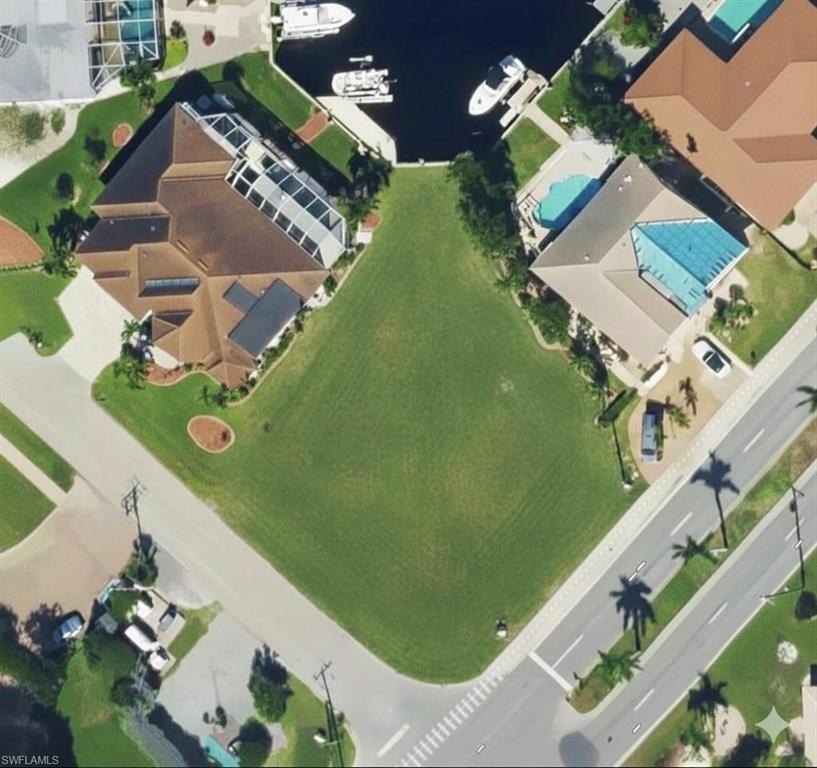 This exceptional waterfront corner lot in Punta Gorda Isles - Beach Lot for sale in Punta Gorda, Florida on Beachhouse.com