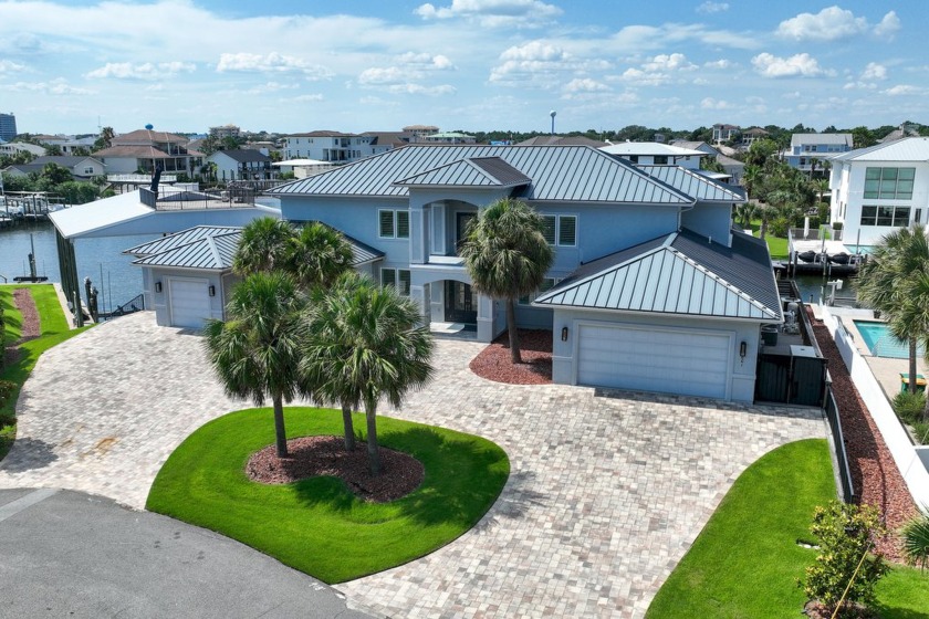 This canal-front home on Holiday Isle sits on a spacious corner - Beach Home for sale in Destin, Florida on Beachhouse.com