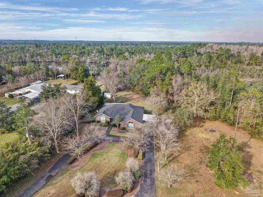 Situated on approximately 1.18 acres, this private Milton - Beach Home for sale in Milton, Florida on Beachhouse.com