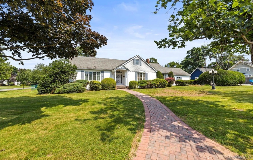 This one-of-a-kind residence combines timeless charm with - Beach Home for sale in Brightwaters, New York on Beachhouse.com