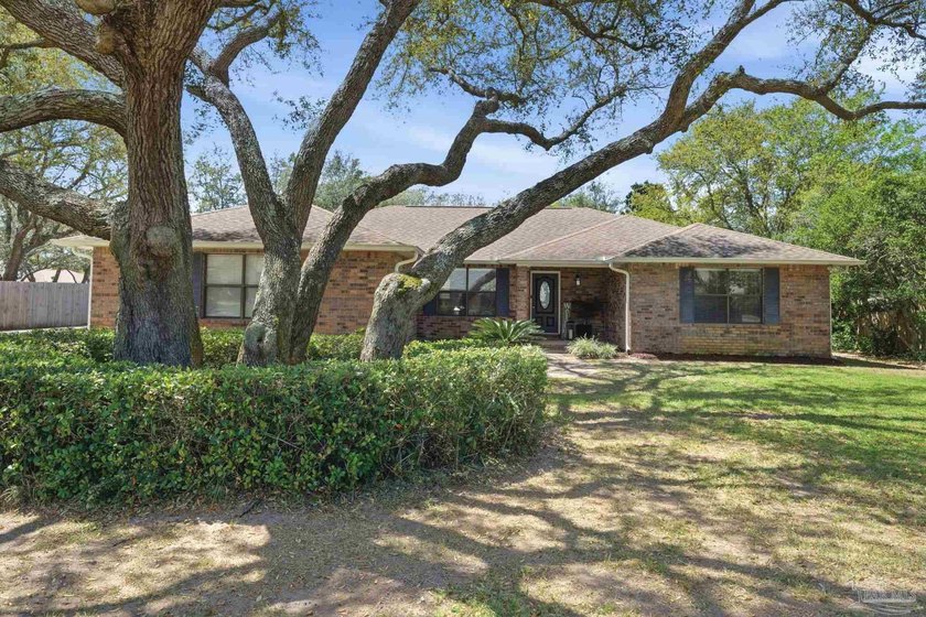 Welcome to this charming 3 bedroom, 2 bathroom brick home - Beach Home for sale in Navarre, Florida on Beachhouse.com