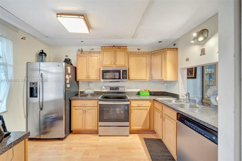 Light and bright 2-bedroom, 2-bath condo in a secure gated - Beach Condo for sale in Lauderhill, Florida on Beachhouse.com