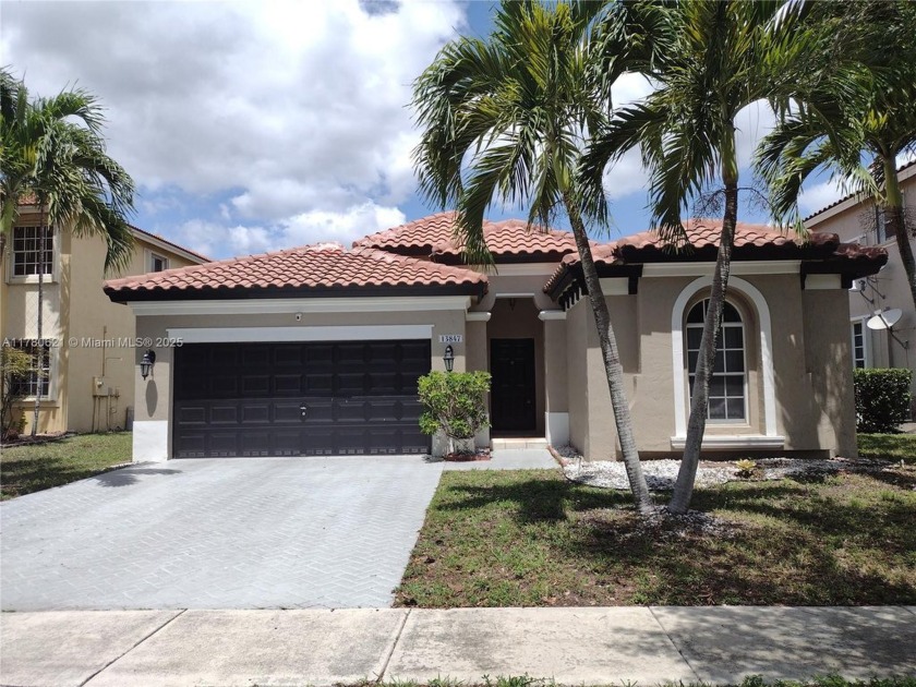Come see for yourself! This beautiful 3/2 2CG home features an - Beach Home for sale in Miramar, Florida on Beachhouse.com