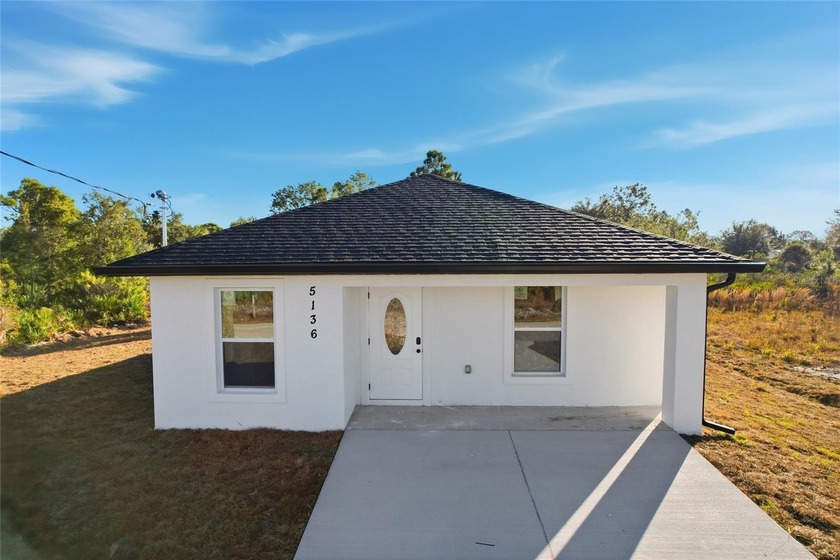 Welcome to this brand-new concrete block home, offering modern - Beach Home for sale in Port Charlotte, Florida on Beachhouse.com