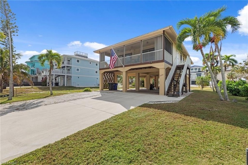A refined coastal sanctuary located directly across the street - Beach Home for sale in Bonita Springs, Florida on Beachhouse.com