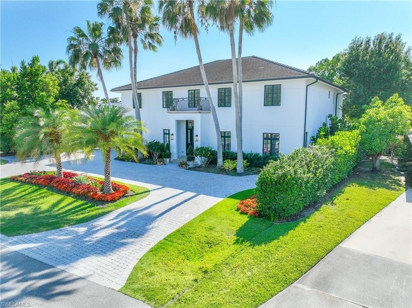 This elegant home showcases a spacious open layout, boasting - Beach Home for sale in Naples, Florida on Beachhouse.com