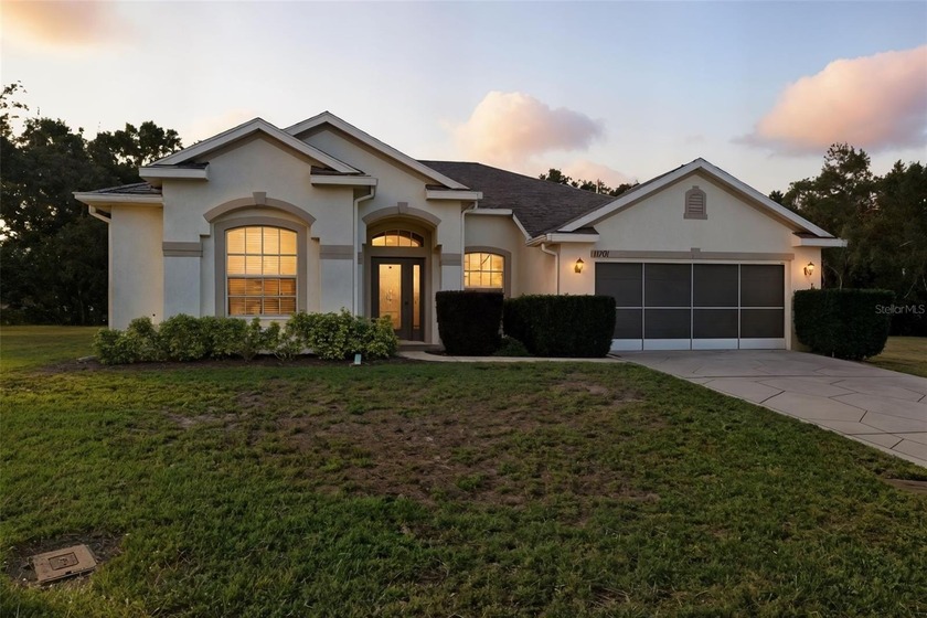 This beautifully maintained 3-bedroom, 2-bath home with a - Beach Home for sale in Spring Hill, Florida on Beachhouse.com