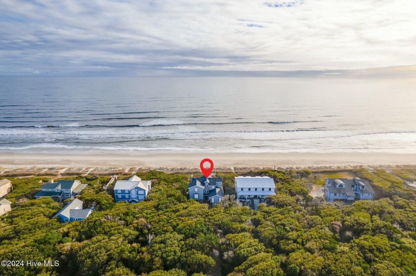 Nestled in a serene oceanfront neighborhood, this beautiful home - Beach Home for sale in Pine Knoll Shores, North Carolina on Beachhouse.com