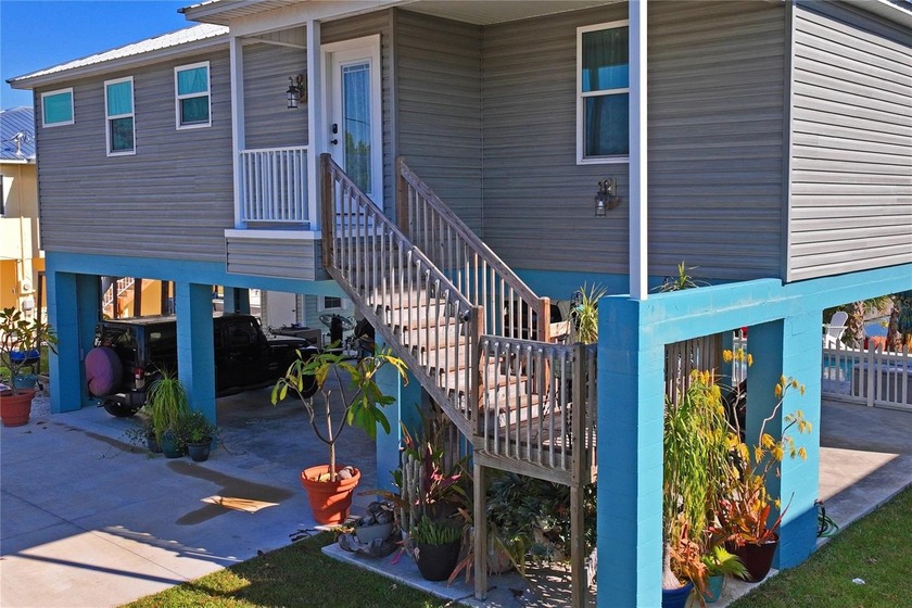 This elevated 2022 Gulfstream Homes custom build delivers modern - Beach Home for sale in Hernando Beach, Florida on Beachhouse.com