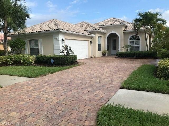 Beautifully updated Oakmont model with a lake view, heated pool - Beach Home for sale in Naples, Florida on Beachhouse.com