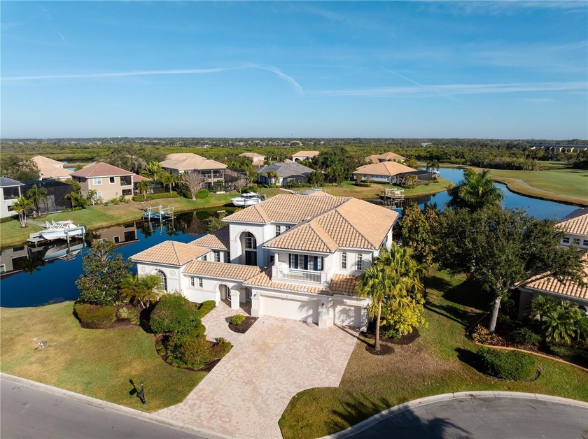 Stunning water and golf course views define this exceptional - Beach Home for sale in Bradenton, Florida on Beachhouse.com