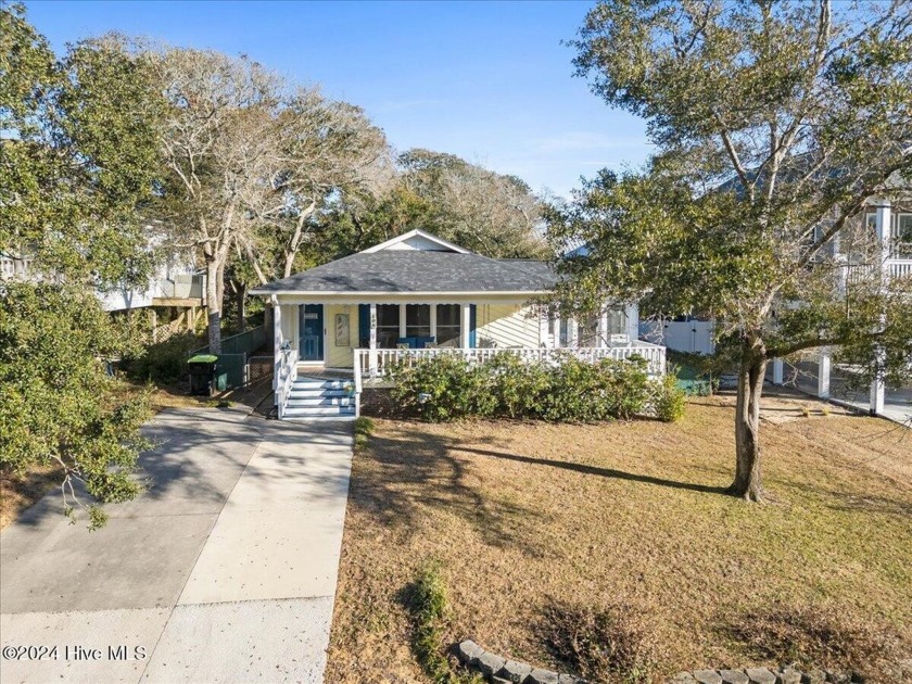 This charming, quaint island cottage oasis awaits you on the - Beach Home for sale in Oak Island, North Carolina on Beachhouse.com