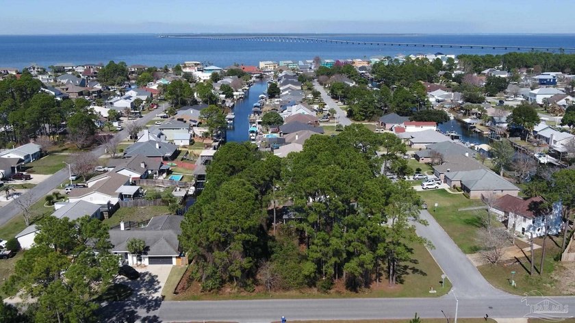 Imagine mornings on your private dock, coffee in hand, as boats - Beach Lot for sale in Gulf Breeze, Florida on Beachhouse.com