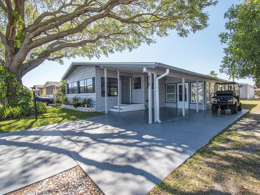 Contemporary, updated home w/ 2023 roof. Open plan, 2 living - Beach Home for sale in Barefoot Bay, Florida on Beachhouse.com