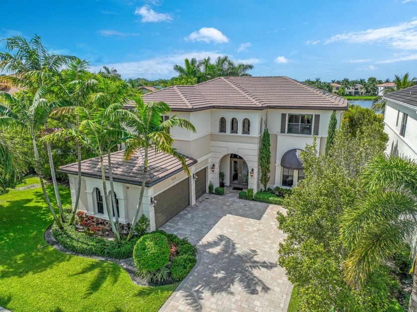 Relax while enjoying the captivating long lake view in this - Beach Home for sale in Boca Raton, Florida on Beachhouse.com