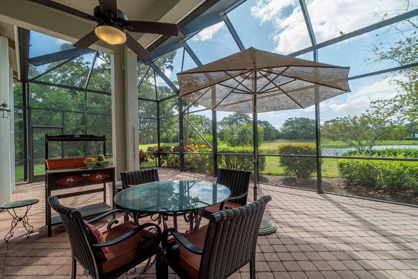 The panoramic view of the lake and golf course welcomes you the - Beach Home for sale in West Palm Beach, Florida on Beachhouse.com