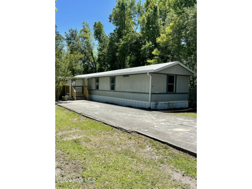 NO city taxes, and NO HOA fees here! 
This wonderful three - Beach Home for sale in Hubert, North Carolina on Beachhouse.com