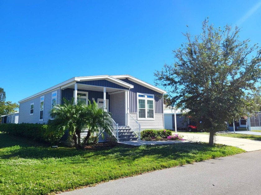 This pristine, absolutely move-in ready 2019 SKYLINE home on a - Beach Home for sale in Sarasota, Florida on Beachhouse.com
