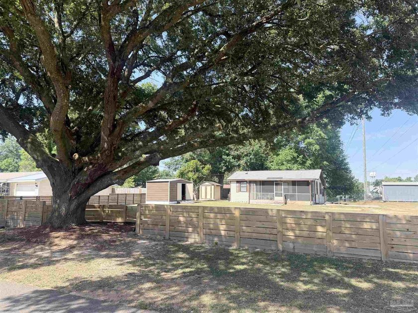 Almost 1 acre in Pace! Immaculately kept 2-bedroom, 1.5-bath - Beach Home for sale in Pace, Florida on Beachhouse.com