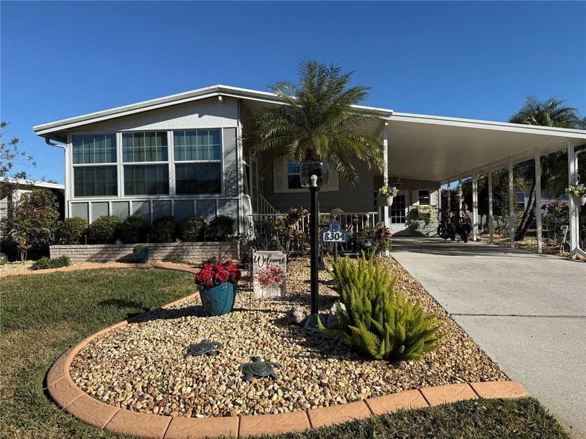 Enjoy comfort and style in this beautifully updated double-wide - Beach Home for sale in Palmetto, Florida on Beachhouse.com