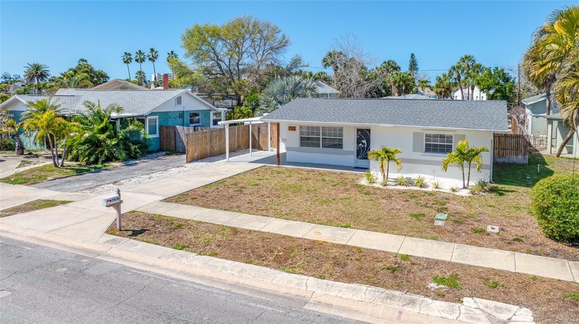 Welcome to 7010 Boca Ciega Drive -- a beautifully updated - Beach Home for sale in ST Pete Beach, Florida on Beachhouse.com