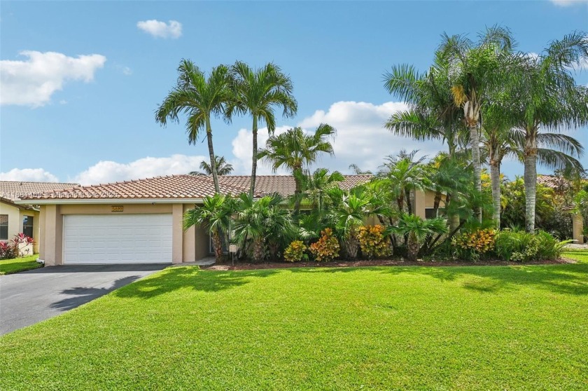 This stunning 4-bedroom, 2-bathroom pool home is situated on a - Beach Home for sale in Davie, Florida on Beachhouse.com