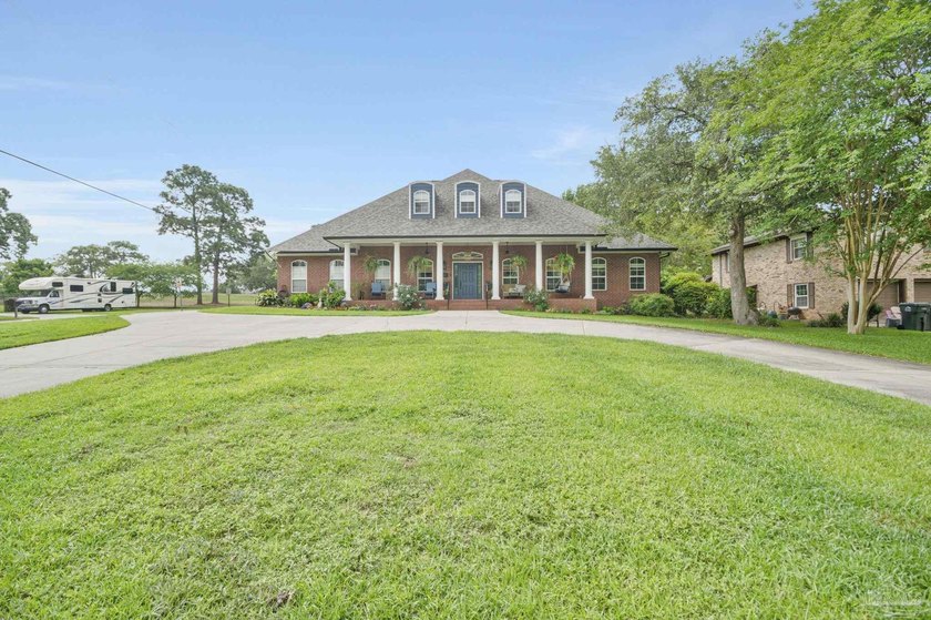 Positioned along the 9th fairway of Scenic Hills Golf Course - Beach Home for sale in Pensacola, Florida on Beachhouse.com