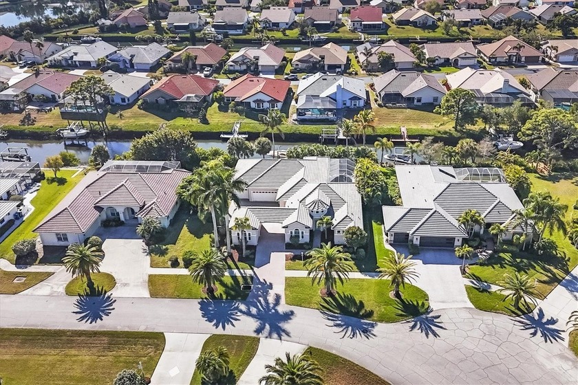 4 BED + DEN / 3.5 BATH / 3 CAR w/ POOL on an OVERSIZED 100' x - Beach Home for sale in Nokomis, Florida on Beachhouse.com