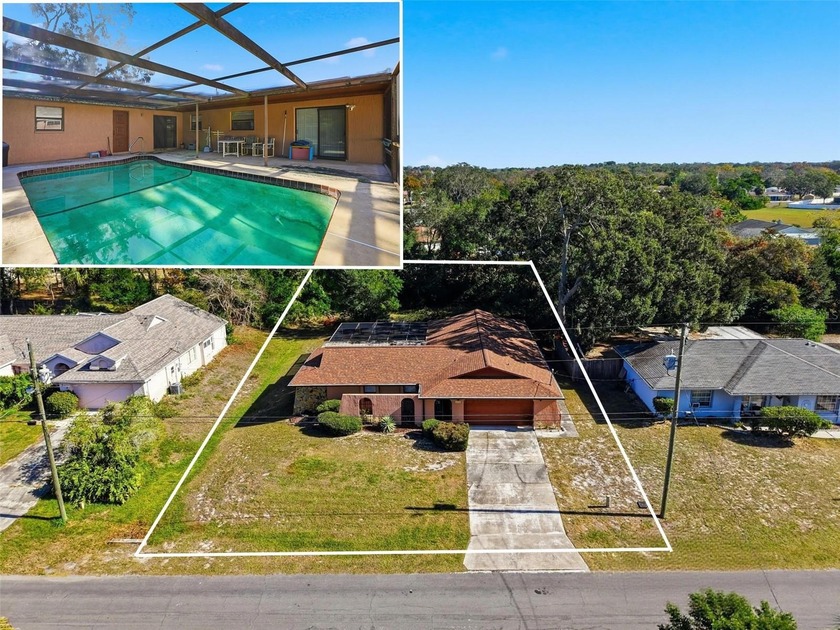 POOL HOME with full MOTHER-IN-LAW SUITE!!  *** NEW ROOF - Beach Home for sale in Spring Hill, Florida on Beachhouse.com